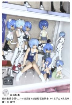 some anime figurines are sitting on a shelf