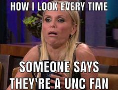 a woman sitting in a chair talking to someone on her cell phone with the caption, how i look every time someone says they're a unc fan