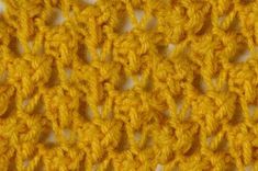 the crochet pattern is yellow and has two rows of stitches on each side