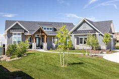 a large house with lots of windows in the front yard