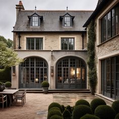 a large house with lots of windows and doors