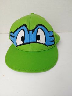 Teenage Mutant Ninja Turtles Fitted Hat age 14+ Size 7 3/8 Green. Shipped with USPS First Class. Casual Snapback Hats For Playtime, Casual Hats For Playtime, One Size Fits Most, Adjustable Themed Green Hat, Adjustable Green Themed Hat, Themed Adjustable Baseball Cap, Adjustable Green Hat For Playtime, Casual Adjustable Hat For Playtime, Adjustable Themed Cap Style Hat, Adjustable Themed Cap