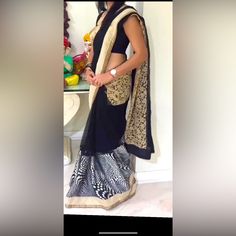 A Beautiful Black And Modern Print Saree With Some Embroidery, Worn For Two Hours. Elegant Black Organza Choli, Black Organza Lehenga For Evening, Black Organza Choli For Festive Occasions, Black Georgette Pre-draped Saree With Resham Embroidery, Black Organza Evening Set, Elegant Embroidered Black Pre-draped Saree, Elegant Black Embroidered Pre-draped Saree, Black Silk Saree With Resham Embroidery, Black Silk Pre-draped Saree With Resham Embroidery