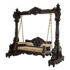 an ornate bed frame with a mattress on it