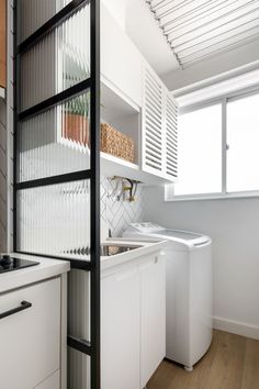 the kitchen is clean and ready to be used as a washer and dryer