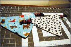 three bandanas are laying on a cutting board and ready to be sewn together