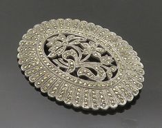 925 Sterling Silver - Vintage Shiny Marcasite Flowers Oval Brooch Pin - BP6837  925 Sterling Silver - Vintage Shiny Marcasite Flowers Oval Brooch Pin - BP6837  Jewelry Type:         Brooch Pin   Metal Type:            925 Silver   Metal Size:             2"  Stone Type:            Marcasite   Condition:              N/A  Jewelry Weight:     19.1 Grams   PLEASE NOTE: THIS ITEM IS PRE-OWNED. ALTHOUGH MOST ITEMS ARE IN VERY GOOD CONDITION, SOME MAY NEED CLEANING AND/OR MINOR REPAIRS. WE MAKE A VERY Beautiful Rings, Types Of Metal, Brooch Pin, Metallic Silver, 925 Silver, Size 2, Handmade Items, 925 Sterling Silver, Sterling Silver