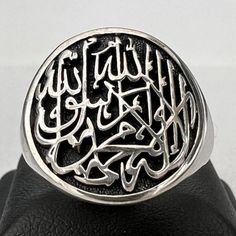 "Shahada Ring, Islamic gifts, Eid gifts, Muslim gifts, Islamic jewelery, Kalima, Arabic Scripture, There is no God but Allah and Muhammad (pbuh) is his Messenger Jewelry Solid Sterling Silver 925! Product Description: The Shahada Ring is a stunning piece of Islamic jewelry that serves as a perfect gift for Eid, Muslim occasions, or as an expression of faith. Crafted with precision and care, this handmade ring showcases the Kalima, the Arabic Scripture which states, \"There is no God but Allah an Islam Jewelry, Saudi Arabia Gold Jewelry, Saudi Arabian Jewelry, Arabic Calligraphy Jewelry, Islamic Necklace, Islamic Jewelry, Eid Gifts, Islamic Gifts, Handmade Ring