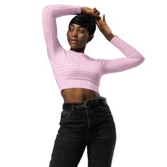 This long-sleeve crop top is made of recycled polyester and elastane, making it an eco-friendly choice for swimming, sports, or athleisure outfits. The crop top has a tear-away care label and a wide, double-layered waistline band for a comfortable fit. • Fabric composition in Europe: 88% recycled polyester, 12% elastane • Fabric weight in Europe: 6.78 oz/yd² (230 g/m²) • Fabric composition in Mexico: 81% REPREVE recycled polyester, 19% LYCRA® XTRA LIFE™ • Fabric weight in Mexico: 7.52 oz/yd² (255 g/m²) • UPF 50+ • Trendy, cropped fit • Wide, double-layered waistline band • Raglan sleeves • Tear-away care label • Size up if you’re between sizes as this fabric can be tight on the body • Blank product components in Europe sourced from Spain • Blank product components in Mexico sourced from Co Fitted Pink Cropped Sweater, Pink Fitted Cropped Sweater, Pink Fitted Long Sleeve Cropped Sweater, Fitted Long Sleeve Crop Top In Athleisure Style, Fitted Long Sleeve Crop Top Athleisure, Fitted Long Sleeve Crop Top For Athleisure, Athleisure Long Sleeve Crop Top For Spring, Fitted Long Sleeve Crop Top For Workout, Trendy Long Sleeve Workout Crop Top