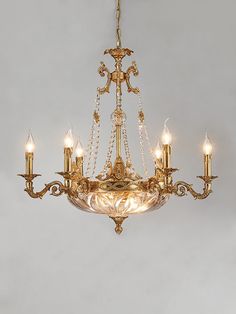 a chandelier with five lights hanging from it