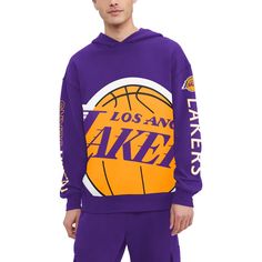 The Tommy Jeans Purple Los Angeles Lakers Kenny Pullover Hoodie is the ultimate way to show your unwavering support for the Los Angeles Lakers. This midweight hoodie features screen-printed graphics that proudly display the Lakers logo and Kenny's iconic number, making it a must-have for any true fan. The fleece lining provides warmth and comfort, while the dropped shoulders and oversized fit offer a relaxed and stylish look. Whether you're cheering from the stands or simply showing your Lakers Collegiate Long Sleeve Hoodie With Logo Print, Team Spirit Long Sleeve Sports Hoodie, Fall Sports Event Hoodie With Logo Print, Athleisure Hoodie With Logo Print For Sports, Throwback Hooded Sports Top, Sports Hoodie With Ribbed Cuffs, Throwback Long Sleeve Fan Gear Hoodie, Throwback Long Sleeve Hoodie For Fan Gear, Athleisure Hoodie With Graphic Print For Sports Events