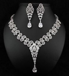 Elegant Silver Bridal Sets For Party, Silver Bridal Sets With Elegant Design For Party, Elegant Silver Bridal Sets With Rhinestones, Elegant Silver Bridal Set For Formal Occasions, Elegant Silver Hand Set Bridal Sets, Diamond White Jewelry Set With Rhinestones For Gift, Formal Silver Bridal Sets With Sparkling Stones, Elegant Silver Cubic Zirconia Bridal Sets, Silver Bridal Set With Rhinestones And Cubic Zirconia