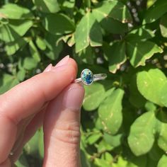 We crush the varying Leland Blue stones that we find and we include a variety of stones colors in each ring. This ring is completely sealed making it UV proof, waterproof, durable and designed to be low profile making it perfect for everyday wear. Each ring will look slightly different due to natural variances in Leland Blue stones, but we make sure that each one is amazing! Available in sizes 5-11. (Note that these rings are handmade, please allow up to 1/4 variance in sizing.) Leland Blue is s Blue Open Ring Crystal Birthstone, Blue Birthstone Crystal Open Ring, Turquoise Sterling Silver Crystal Promise Ring, Turquoise Sterling Silver Crystal Ring For Promise, Turquoise Crystal Promise Ring In Sterling Silver, Everyday Sapphire Ring Jewelry, Stackable Blue Birthstone Promise Ring, Everyday Oval Stackable Rings With Birthstone, Adjustable Sterling Silver Turquoise Birthstone Ring