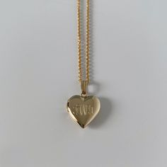 A child's plain polished 14K yellow gold-filled heart-shaped locket on a cable chain necklace. The outer shell is solid gold pressure-bonded to an inner core of high-quality brass. Locket Dimensions: 13 mm W x 21 mm H Chain Length: 15" Cable Chain Necklace, Heart Locket Necklace, Inner Core, Heart Locket, Locket Necklace, Cable Chain, Chain Lengths, Chain Length, Locket