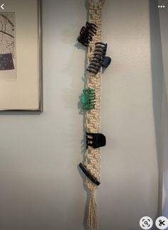 there is a hair brush holder hanging on the wall