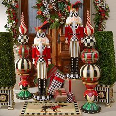 christmas decorations are displayed in front of a door