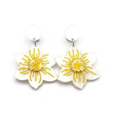 "These white and yellow daffodil earrings are the perfect statement piece for spring. These springy flower earrings are laser cut from acrylic and handpainted to create a vintage inspired design that is lightweight and comfortable to wear.  The best bits in a nutshell: - Nickel free earring posts - meaning no more irritated ears for those who are sensitive - Lightweight acrylic design - so you can wear them in comfort all day Other details: - Earrings measure 55 mm (2.17\") from top of stud to b Spring White Jewelry With Matching Earrings, White Jewelry With Matching Earrings For Spring, Handmade White Flower Earrings For Spring, White Handmade Flower Earrings For Spring, White Drop Earrings For Spring, Spring White Handmade Flower Earrings, Yellow Flower Charm Earrings For Spring, White Flower Decorated Earrings For Spring, Yellow Spring Earrings