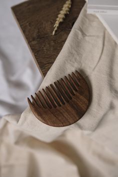 A Dream Realized: Our Exquisite Handcrafted Wooden Comb Imagine the perfect comb, and we've brought it to lifew Every tooth and curve of the DomnWood comb is a result of meticulous handcraftsmanship. Finished with natural oil wax, this comb prevents static, ensuring your hair remains smooth and tangle-free. This comb is designed to care for your hair and last a lifetime with minimal maintenance. Simply wipe it dry if it gets wet, and occasionally treat it with flaxseed oil to keep it looking as Wooden Hair Comb, Wooden Hair Brush, Wood Comb, Viking Hair, Hair Photography, Wooden Comb, Flaxseed Oil, Beard Grooming, Hair Shine