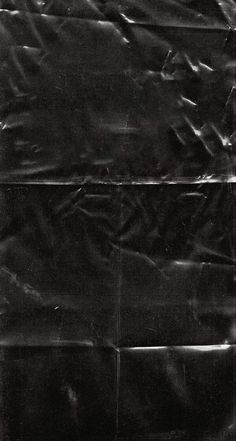 an old black and white photo of a piece of plastic