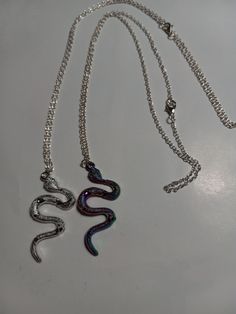 snake necklace, silver snake or multicolor snake on silver chain, animal lovers and snake lovers will adore. Silver Snake Necklace For Party, Silver Snake-shaped Chain Necklace As Gift, Silver Snake Shape Chain Necklace As Gift, Snake-shaped Metal Necklace For Gift, Metal Snake-shaped Necklace For Gift, Metal Snake Shape Necklace As Gift, Silver Snake Shape Clavicle Chain Necklace, Silver Snake Chain Clavicle Necklace As A Gift, Silver Snake Shape Necklace With Clavicle Chain