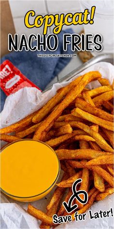 a close up of french fries on a plate with mustard in the background and text that reads copycat nacho fries save for later