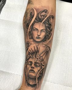 a woman's leg with a tattoo on it and an image of a demon