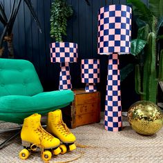 roller skates are lined up in front of a chair and table with colorful decorations