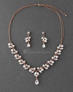 a necklace and earring set with pearls