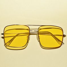 These 1970s vintage style sunglasses feature an oversized square lens, are outlined with a chic gold rim, provide UV 400 protection and comes in three translucent colors. Each sold separately. Dimensions: Length: 6 inches Lens diameter: 2.2 inches Retro Gold Sunglasses For Beach, Retro Square Frame Aviator Sunglasses For Summer, Gold Retro Sunglasses For Summer, Retro Gold Sunglasses For Summer, Retro Gold Rectangular Sunglasses, Gold Retro Summer Sunglasses, Vintage Gold Sunglasses For Summer, Retro Gold Square Frame Sunglasses, Rectangular Yellow Sunglasses For Summer