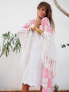 Very unique on of a kind hand made silk crochet from the 1960’s in pink and off white yarn up-cycled kimono style jacket with oversize sleeves and tassel details by Vagabond Ibiza. In perfect condition Free size Spring Bohemian Crochet Shawl, Handmade Bohemian Shawl For Spring, Bohemian Spring Poncho With Tassels, Spring Festival Crochet Shawl, Crochet Shawl For Spring Festival, Bohemian Pashmina Shawl For Spring, Bohemian Spring Shawl With Tassels, Bohemian Shawl With Tassels For Spring, White Handmade Shawl For Spring