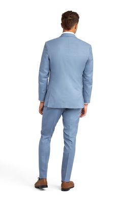 A slim light blue suit with two buttons and a notch lapel. Light Blue Notch Lapel Suits For Work, Classic Fitted Light Blue Suit, Blue Slim Fit Suits With Welt Pockets, Classic Light Blue Fitted Suit, Blue Double Breasted Suit For Spring Formal, Blue Slim Fit Suit With Pressed Crease, Blue Slim Fit Suits With Pressed Crease, Blue Classic Slim Fit Double Breasted Suit, Slim Fit Blue Suit With Pressed Crease