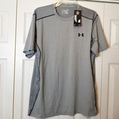 Under Armour Heatgear Fitted Athletic Shirt. Gray With Black Trim. Size L. Flat Lay Approximate Measurements Armpit To Armpit 22" Length Top To Bottom 28.5" Condition: Nwt Gray Moisture-wicking Sports Shirt, Sporty Gray Crew Neck Shirt, Gray Short Sleeve Sports Shirt, Casual Gray Sports Shirt, Under Armour Gray Crew Neck Top, Usa Shorts, Freedom Shirts, Compression Shirt, Under Armour Shirts