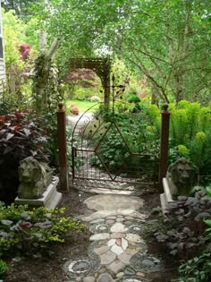 an outdoor garden with stone walkways and statues