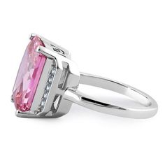 Top of ring height: 14.32mm

Top of ring width: 12.6mm

Band width: 2.2mm

Shank width: 1.9mm



Stone material: pink & clear cubic zirconia

Center stone size: 14mm X 10mm

Stone shape: radiant cut

Center stone carat weight: 8.47 ct.

Total number of CZ stones: 11

Stone setting: Prong setting



Metal: 925 sterling silver

Plating: rhodium plated

Finish: high polish Pink Rectangular Stone Ring For Anniversary, Pink Radiant Cut Diamond Ring For Anniversary, Formal Pink Rectangular Ring, Rectangular Cubic Zirconia Rings With Accent Stones, Pink Rectangular Rings For Anniversary, Pink Radiant Cut Ring With Prong Setting, Pink Radiant Cut Promise Ring, Elegant Pink Rings With Rectangular Stone, Pink Radiant Cut Ring For Formal Occasions