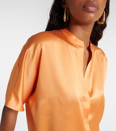 Find VINCE Silk Satin Blouse on Editorialist. Material: 100% silk. Care instructions: hand wash. Made in China. Designer color name: Kumquat. Closure: concealed buttoned front. Orange Silk Summer Tops, Orange Silk Top For Summer, Summer Orange Silk Tops, Spring Orange Silk Top, Orange Silk Top For Spring, Designer Silk V-neck Blouse, Orange Silk Tops For Spring, Elegant Orange Blouse For Work, Designer Silk V-neck Tops