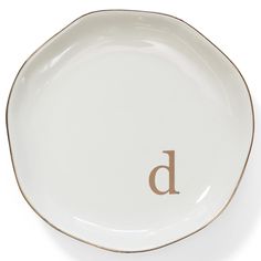 a white plate with the letter d on it