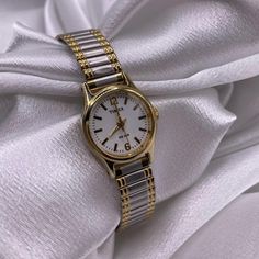 Gorgeous Two Tone Dainty Classy Stretch Band Watch by Timex  . . Installed new battery  Excellent working condition  .      Vintage, Gold, Silver, Two-tone, Coquette, Retro, Elegant, Princess, Unique, Iridescent, Diamonds, Crystals, Watch, Old money, Timex, Citizen, Geneva, Timeless, Modern, Timepiece, Quartz, Antique, Victorian, Deauville, Geneva, Bulova, link, Chain, Cuff, Bracelet, Art deco, Dainty, Mother of pearl face, cameo watch, Fairywatch, Mermaid, Gold Jewelry,  Disclaimer: Please keep in mind this is a second hand item we try our best to clean the item. Item will be sanitized before shipping out, found in very good condition minimal sign of wear on the back of the case and band. Watch Old, Bracelet Art, Minimalist Watch, Stretch Band, Stretch Bands, Women Wrist Watch, Antique Victorian, Old Money, Link Chain