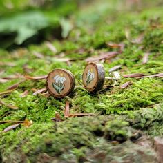 "Sweet little wood slice earrings sourced from my forest in rural NY, hand painted with little daisy flowers. I use different types of wood for these earrings, making each pair unique! Tiny tree rings can be seen, and they are sealed with a protective varnish, and have an attached sterling silver post and ear nut. Earrings are approximately 1/4\" wide. Choose the earring pair you want based on the photos, if you want a closer up photo of a certain pair please let me know! Please note while these Wood Flower Earrings, Nature-inspired Flower Earrings With Birth Flower For Gift, Handmade Nature-inspired Flower Earrings, Nature-inspired Flower Earrings For Birth Flower Gift, Nature-inspired Flower Earrings, Nature-inspired Birth Flower Earrings For Gift, Flower Shaped Natural Color Jewelry For Gifts, Flower Shaped Natural Jewelry For Gift, Nature-inspired Natural Wood Earrings For Gift