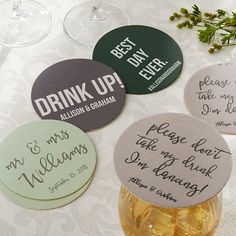 four coasters that say drink up and have been written on them