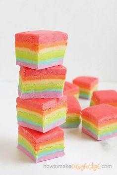 rainbow fudge candy bars stacked on top of each other with the text overlay