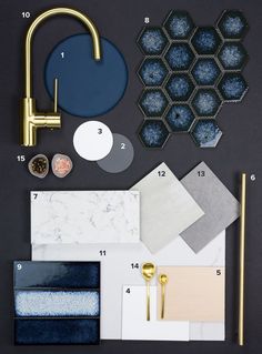 an assortment of different materials are arranged on a table with blue and white colors, including gold