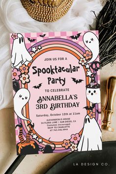 a halloween party with spooktacular party card and other items on the table