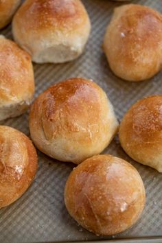 freshly baked bread rolls on a baking sheet