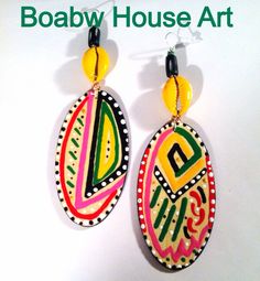 Hand painted with acrylic paints and glossed with a clear gloss for protection. Made out of a lightweight wood. Size 5in Hand Painted Yellow Artsy Earrings, Yellow Hand Painted Artsy Earrings, Artistic Hand Painted Yellow Earrings, Artisan Hand Painted Earrings For Festival, Handmade Yellow Artsy Earrings, Handmade Artsy Yellow Earrings, Artistic Hand Painted Earrings For Festival, Artistic Hand Painted Festival Earrings, Bohemian Hand Painted Earrings For Festivals