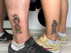 two people with matching tattoos on their legs