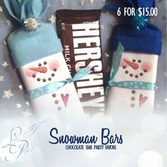 two snowman bars are wrapped in blue ribbon