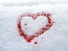 a heart - shaped object is covered in snow