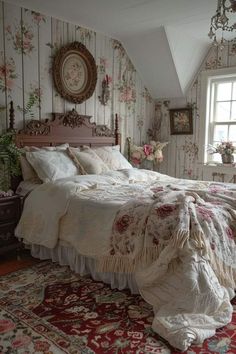 a bedroom with floral wallpaper and an old fashioned bed in the middle of it