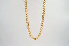 Simplicity at its finest. This slim curb chain is made to worn everyday with your favorite outfit. Wear it alone or layer it with your other necklaces. 18K Gold Plated; Stainless Steel Length: 18 inches ; Chain Width: 5mm Classic Curb Chain Necklace For Layering, Dainty Link Chain Necklace With Curb Chain, Classic Cuban Link Chain Necklace For Everyday, Dainty Curb Chain Link Necklace, Curb Chain Link Necklace For Layering, Layering Curb Chain Link Necklace, Classic Cuban Link Necklace For Everyday, Classic Cuban Link Necklace, Classic Cuban Link Necklace With Adjustable Chain For Everyday