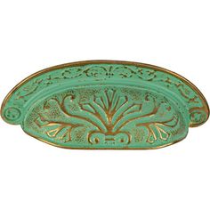 an ornate green and gold tray with decorative designs on the front, set against a white background